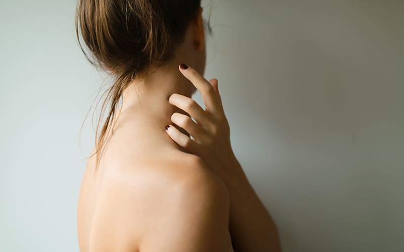 women holding neck
