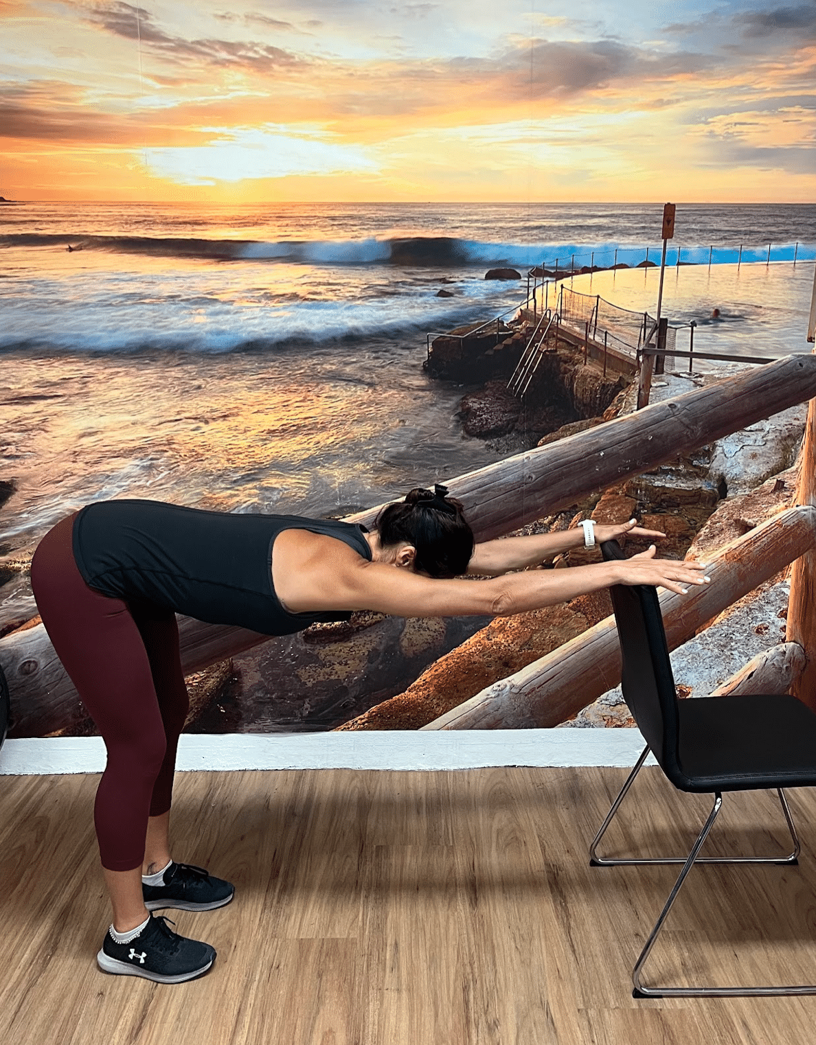 lat back stretch on back of chair standing